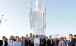 The statue of Pope Leo in Chiclayo, Peru, is surrounded by some of the people who attended its inauguration and blessing.