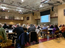 Parishioners at Sacred Heart parish in Valley Park, Missouri, part of the Archdiocese of St. Louis, listen to a presentation about parish mergers at an October 2022 listening session.
