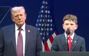 Shane Encinas, 12, shown here with President Donald Trump, was among the students who recounted their experiences facing religious discrimination in American public schools at a Religious Liberty Commission hearing on Sept. 8, 2025, in Washington, D.C. Credit: Courtesy of U.S. Department of Justice/Screenshot