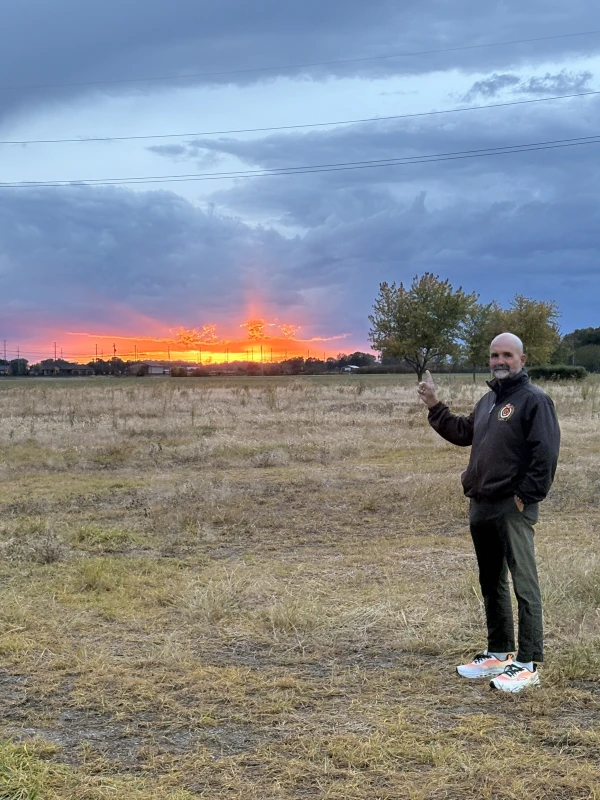 Father Gary Graf poses before a sunrise near Fremont, Ohio, Tuesday, Oct. 21, 2025. Credit: Photo courtesy of Father Gary Graf