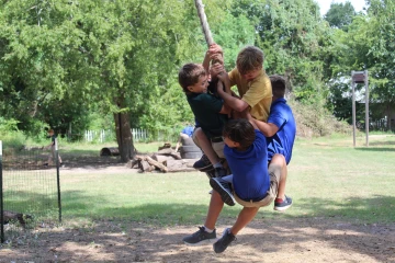 Western boys swinging