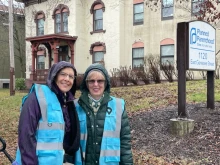 Sidewalk advocates withstand the rain to be present outside a Planned Parenthood in Syracuse, New York.