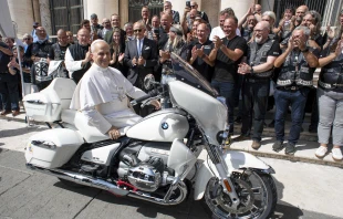 Pope Leo XIV poses on a custom BMW R 18 papal motorcycle gifted to him by the Christian Jesus Bikers at the Vatican, Wednesday, Sept. 3, 2025. Credit: Vatican Media