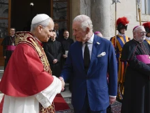 Pope Leo XIV and King Charles III meet before their prayer together in the Sistine Chapel during a historic meeting at the Vatican on Thursday, Oct. 23, 2025.