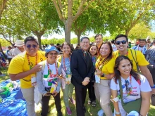 Cardinal Luis Antonio Tagle and pilgrims from the Philippines at the 2023 World Youth Day in Lisbon, Portugal