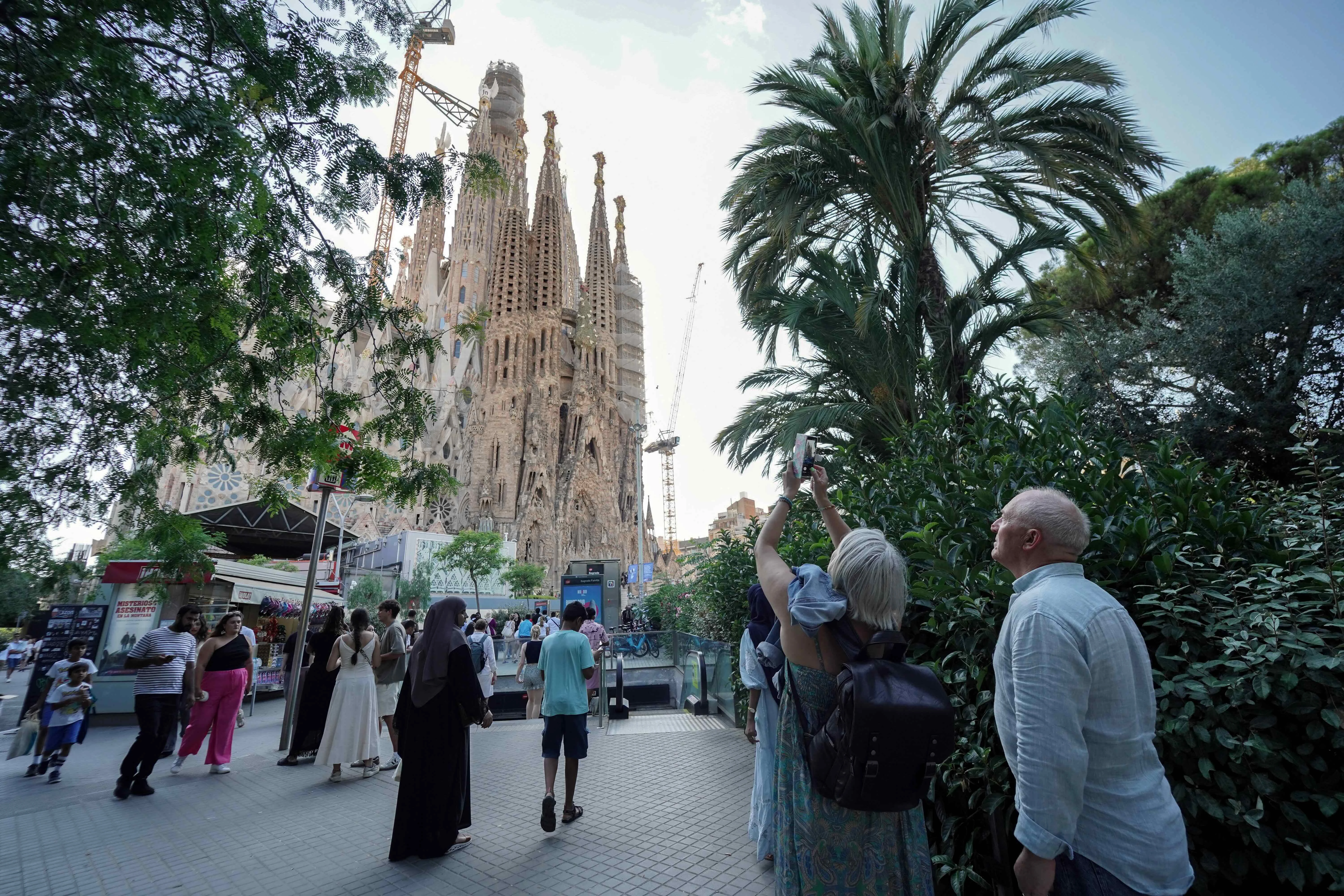 Tourists take photos as they visit the Sagrada Familia basilica in Barcelona on Aug. 2, 2025.?w=200&h=150