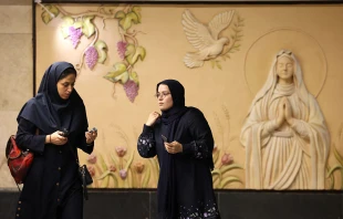 Iranian women walk in front of a relief sculpture of the Virgin Mary at the newly-opened Maryam Moghaddas (Virgin Mary) metro station near the Sarkis Cathedral of the Armenians in Tehran on Oct. 18, 2025. Credit: ATTA KENARE/AFP via Getty Images