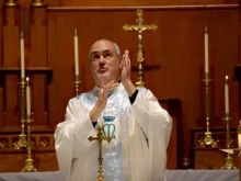 Father Mike Depcik, one of the few Deaf priests in the world, signs a Catholic Mass in American Sign Language.
