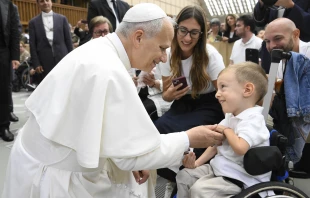 Pope Leo XIV greets sick and disabled people, including a young child in a wheelchair, in the Vatican’s Paul VI Hall after the Wednesday general audience on Sept. 10, 2025. Credit: Vatican Media