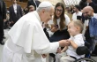 Pope Leo XIV greets sick and disabled people, including a young child in a wheelchair, in the Vatican’s Paul VI Hall after the Wednesday general audience on Sept. 10, 2025.