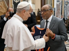 Film director Spike Lee gives Pope Leo XIV a customized New York Knicks jersey at the Vatican on Nov. 15, 2025.