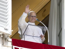 Pope Leo XIV at a window of the Vatican’s Apostolic Palace leads pilgrims in reciting the Angelus, on Sept. 14, 2025, the pope’s 70th birthday.