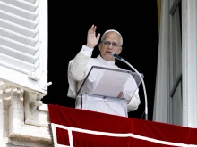 Pope Leo XIV waves to pilgrims gathered for his Sunday Angelus in St. Peter’s Square at the Vatican on Sept. 14, 2025.
