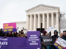 Demonstrators rally on the steps of the United States Supreme Court on Dec. 4, 2024, as justices heard oral arguments in a challenge to a Tennessee law banning transgender surgeries for minors.