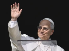 Pope Leo XIV greets pilgrims gathered in St. Peter’s Square at the Vatican for the Angelus on Dec. 14, 2025.