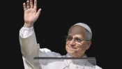Pope Leo XIV greets pilgrims gathered in St. Peter's Square at the Vatican for the Angelus on December 14, 2025.
