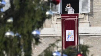 Pope Leo XIV greets pilgrims gathered in St. Peter’s Square at the Vatican for the recitation of the Angelus on Dec. 21, 2025.