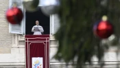 Pope Leo XIV addresses pilgrims gathered in St. Peter's Square at the Vatican for the recitation of the Angelus on December 26, 2025.