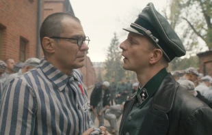 From left to right: Actor Marcin Kwaśny as Maximilian Kolbe and Christopher Sherwood as Karl Fritzsch in “Triumph of the Heart.” Credit: Triumph of the Heart movie/Sherwood Fellows