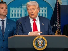 President Donald Trump holds a press briefing with Defense Secretary Pete Hegseth in August 2025.