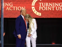Erika Kirk embraces U.S. President Donald Trump at the conclusion of the memorial service held for Charlie Kirk in Glendale, Arizona, on Sept. 21, 2025.