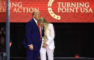 Erika Kirk embraces U.S. President Donald Trump at the conclusion of the memorial service held for Charlie Kirk in Glendale, Arizona, on Sept. 21, 2025. Credit: Joe Raedle/Getty Images