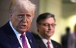 With Speaker of the House Mike Johnson by his side, President Donald Trump speaks to the press following a House Republican meeting at the U.S. Capitol on May 20, 2025, in Washington, D.C.