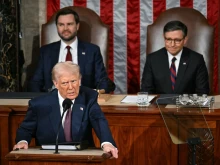 U.S. President Donald Trump addresses a joint session of Congress in the House Chamber of the U.S. Capitol in Washington, D.C., on March 4, 2025, as Vice Preseident JD Vance (back left) and Speaker of the House Mike Johnson (back right) look on.