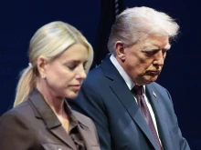 U.S. President Donald Trump bows his head in prayer with Attorney General Pam Bondi at the Museum of the Bible on Sept. 8, 2025, in Washington, D.C. Trump addressed the White House Religious Liberty Commission during the event.
