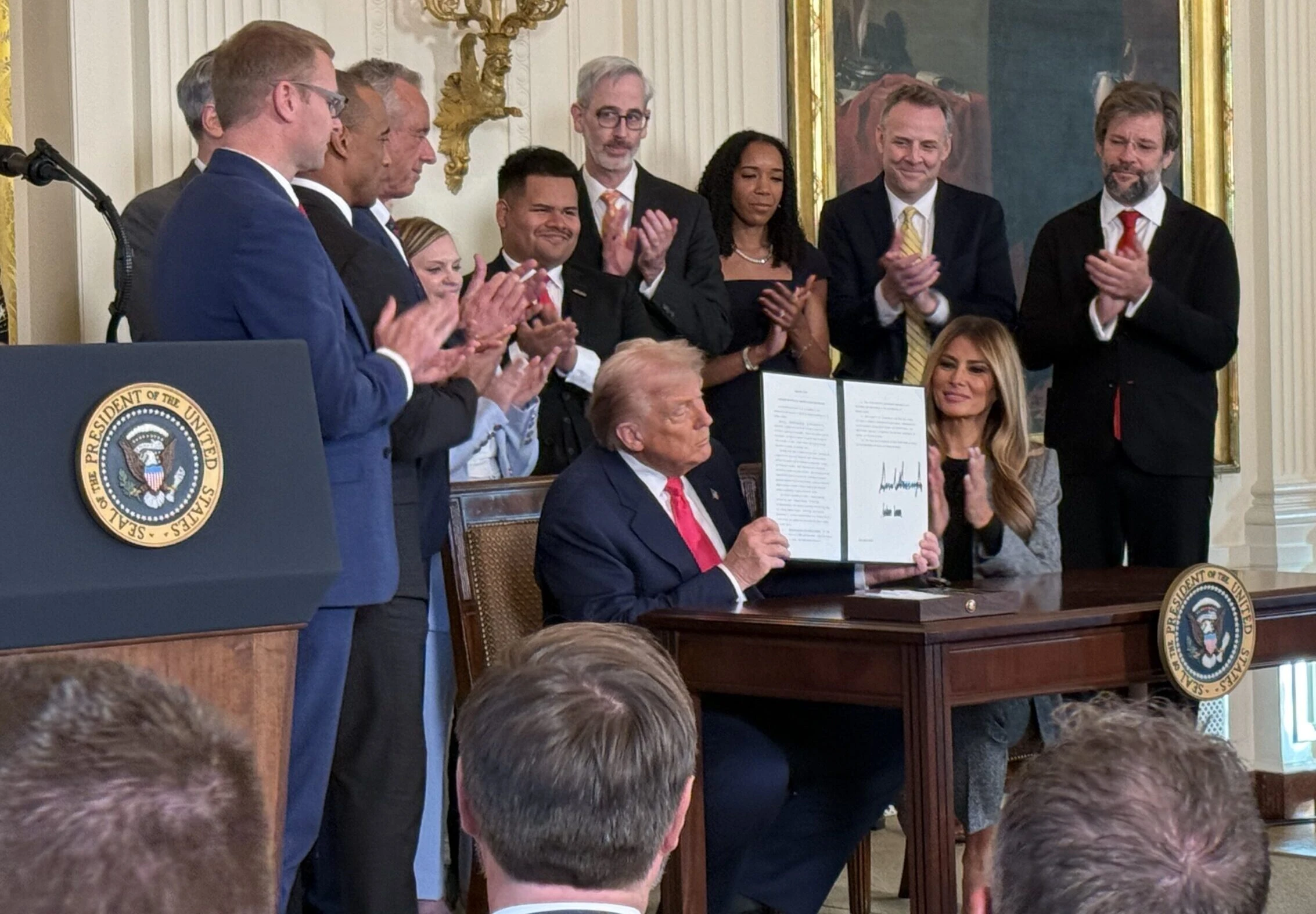 President Donald Trump signs an executive order related to foster care and foster parents on Nov. 13, 2025.?w=200&h=150