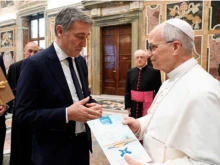 Pope Leo XIV meets the president of the Italian Anti-Usury Council, Luciano Gualzetti, on Oct. 18, 2025.