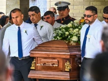 Pallbearers and U.S. Marine Christian Garcia, son of Linda Garcia, carry the casket of Irma Linda Garcia and her husband Jose Antonio Garcia during their funeral mass at Sacred Heart Catholic Church in Uvalde, Texas, on June 1, 2022. Irma Garcia, a teacher, was killed in a mass shooting at a local elementary school on May 24, 2022.