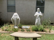 A vandalized statue of Mary, the Mother of God, at St. Leo Parish in Hartford, Arkansas, in July 2024.
