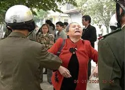 One of the protestors in Hanoi being manhandled by the police?w=200&h=150