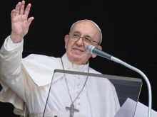 Pope Francis waves during his Angelus address at the Vatican, Aug. 2, 2021.