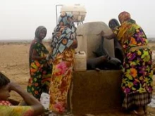 Women collect water in a region of Ethiopia where CRS has been working on drought mitigation projects since 2003 / 