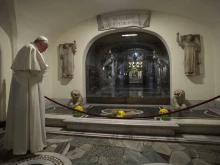 Pope Francis prays before the tombs of deceased popes in the crypt beneath St. Peter’s Basilica, Nov. 2, 2021.