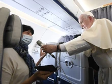Pope Francis speaks during an in-flight press conference on the journey from Athens to Rome, Dec. 6, 2021
