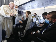 Pope Francis speaks during an in-flight press conference on the journey from Athens to Rome, Dec. 6, 2021.