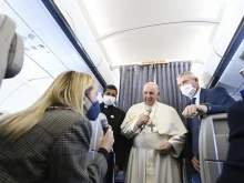 Pope Francis speaks during an in-flight press conference on the journey from Athens to Rome, Dec. 6, 2021.