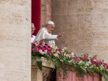 Pope Francis gives his urbi et orbi Easter blessing from the central loggia of St. Peter’s Basilica on March 31, 2024.