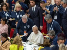 Pope Leo XIV shares lunch with people in need at the Vatican on Nov. 16, 2025.