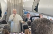 Pope Leo XIV talks to reporters during his flight to Lebanon on Nov. 30, 2025.