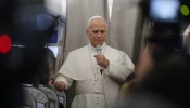 Pope Leo XIV speaks with reporters on his flight from Beirut to Rome on Dec. 2, 2025.