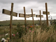 Crosses stand in a row at the Wounded Knee Memorial in South Dakota.