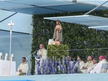 Cardinal Manuel Clemente, the Patriarch of Lisbon, greets attendees of World Youth Day at the opening Mass on Aug. 1, 2023, in Lisbon, Portugal.