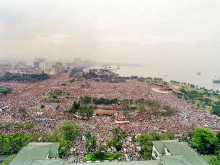 Pope John Paul II's helicopter flies over the huge crowd in Manila's Luneta Park prior to celebrating an open-air mass for an estimated two-million people gathered for the 10th World Youth Day on Jan. 15, 1995.