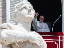 Pope Francis waves during an Angelus address at the Vatican.