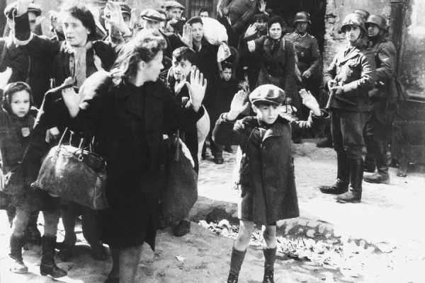 A photograph taken during the Warsaw Ghetto Uprising and included in Jürgen Stroop’s report to Heinrich Himmler in May 1943. / Public domain