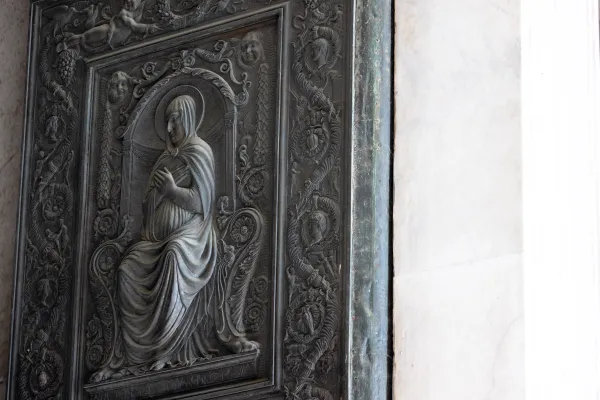 According to Father Agnello Stoia, the pastor of the parish of St. Peter’s Basilica, the 15th-century image of Mary on the oldest door of St. Peter’s Basilica is a reminder of Mary’s title “Gate of Heaven.” Daniel Ibañez/CNA